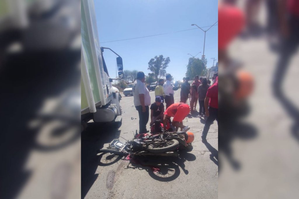 motociclista aplastado camión basura